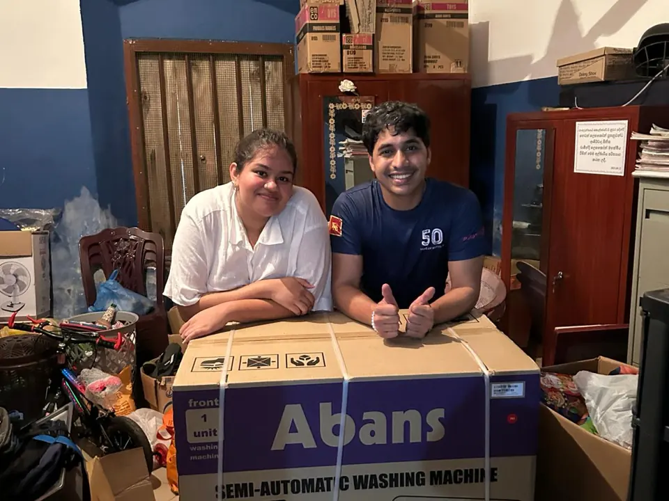 Members delivering a washing machine to Baranasooriya Children’s Home