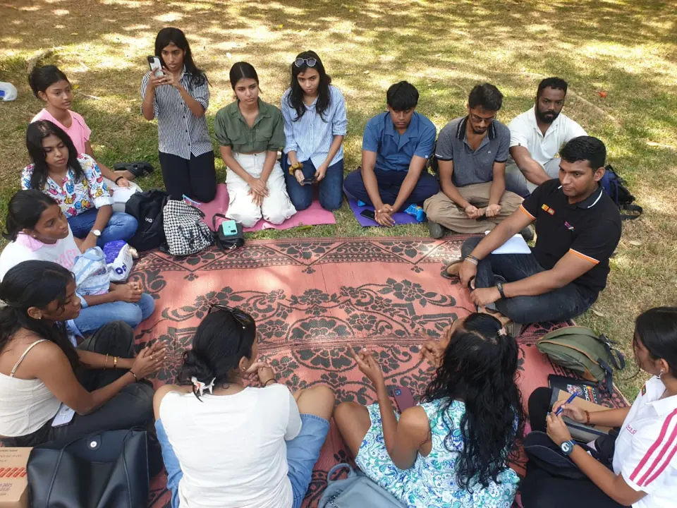 Participants seated in a circle during the journaling session